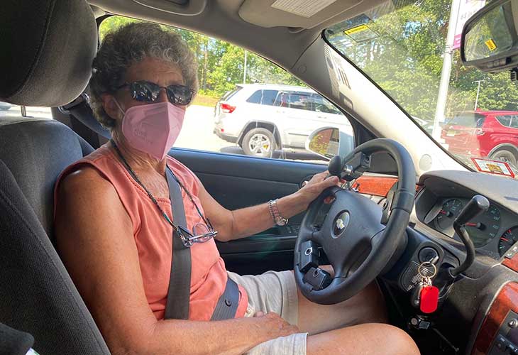 Kathy in her car.